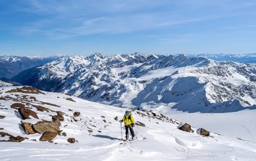 Ski tourers ascending Monte Cevedale, mountain panorama, snow-covered mountain landscape in winter,