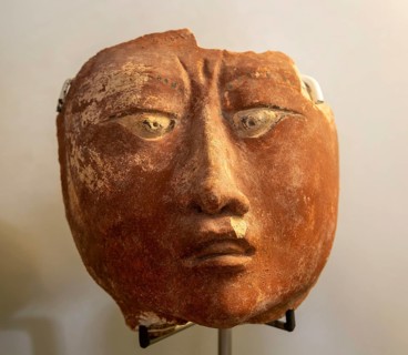 Face with eye squint, from Naachtún, Late Classic period, Mayan archaeological museum, Fort San