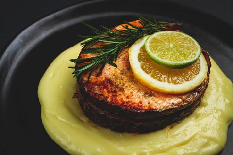 Salmon steak, fried, mashed potatoes, top view, rosemary, lemon and lime, homemade, one serving, no