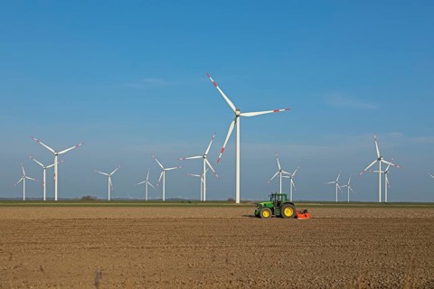 Wind farm, wind power plants, tractor, Reußenköge, North Frisia, Schleswig-Holstein, Germany,