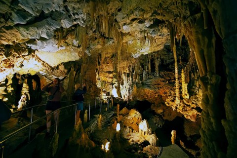 Cave with illuminated stalactites and stalagmites, stalactite cave, Diros Cave, Glyfada Cave,