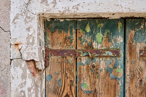 Detail of weathered wood from an old window shutter, Burano, Venice Italy