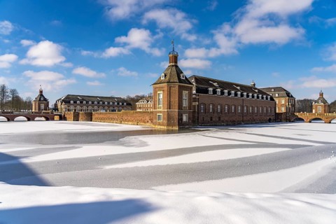 The snow-covered Nordkirchen Castle in winter, Nordkirchen, Münsterland, North Rhine-Westphalia,