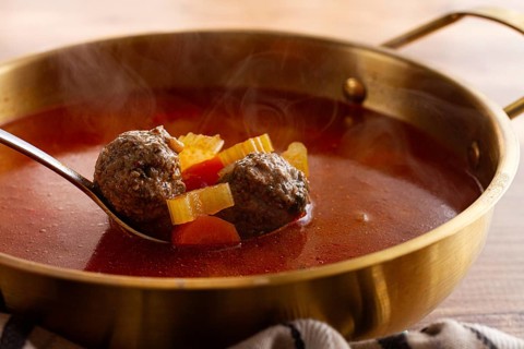 Romanian soup with meatballs, vegetable soup with meatballs, in a pot, homemade, no people