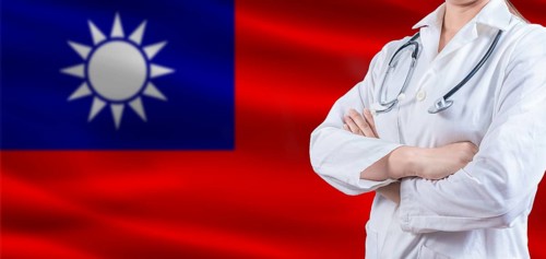 Doctor With Crossed Arms On Taiwanese Flag. Taiwan Health And Care Concept. Female Doctor On