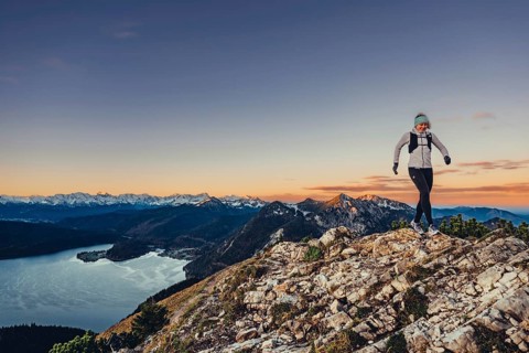 Trail running in autumn on the Jochberg on Lake Walchensee against the wonderful backdrop of the