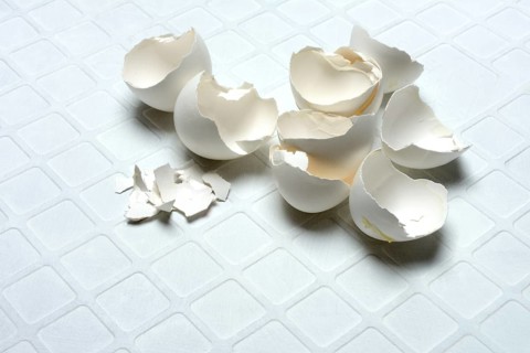 Broken eggshells on a light-coloured background