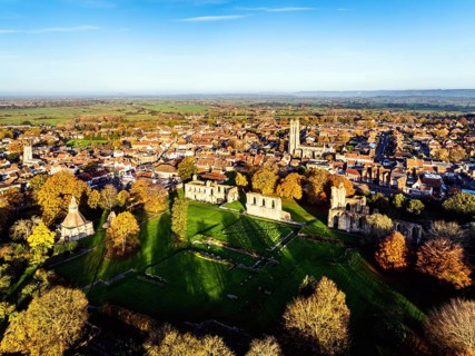 Sunrise over Glastonbury Abbey from a drone, Glastonbury, Somerset, England, United Kingdom, Europe