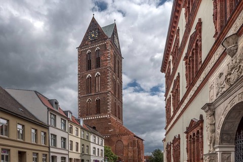 Remaining tower of St Mary's Church, built from 1260-70, on the right is the former Fürstenhof,