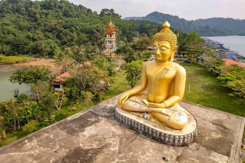 The big Buddha of Wat Ao Salat in the fishing village of Ban Ao Salad seen from the air, Ko Kut