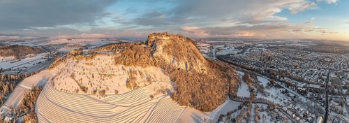 Aerial view, panorama of the snow-covered Hegau volcano Hohentwiel with Germany's largest castle