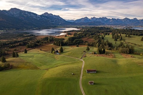 The Allgäu with Bannwaldsee, Forggensee and the Alps seen from the air, Schwangau, Allgäu, Bavaria,