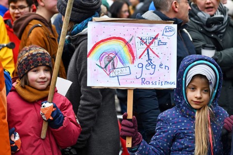 Heidelberg, Germany - February 12th 2025: Children with signs at protest against far-right