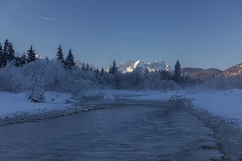 Isar valley in winter at temperatures of minus 18 degrees Celsius. Snow covered landscape with the