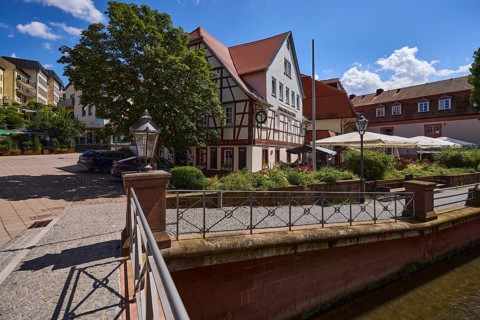 Erbacher brewhouse, restaurant, half-timbered house, river Mümling, metal railing, lantern, blue