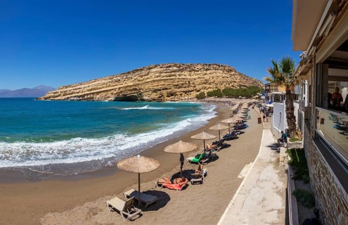 Matala beach with a view of the rock caves, south coast, Crete, Greece, Europe
