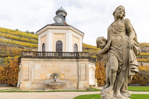 Belvedere of Wackerbarth Castle and sandstone figure with autumn-coloured vineyards, Radebeul,