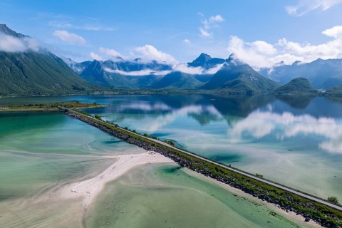 Fjord and mountains of the island Austvågøya, road on dam, Grunnførfjorden, Lofoten, Norway, Europe