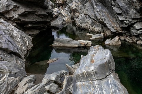 Rocks, granite rock formations in the Maggia River near Ponte Brolla, in the Maggia Valley, Valle