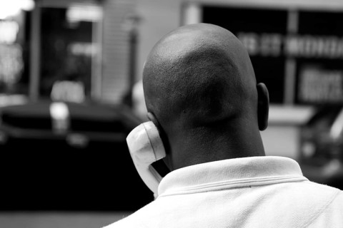Coloured New Yorker talking on a street phone, New York City, USA, North America