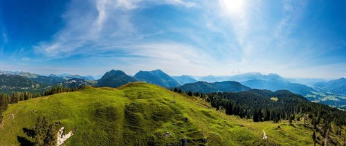 Drone shot, at the summit of the Taborberg with a view of the Osterhorn group and Dachstein massif,