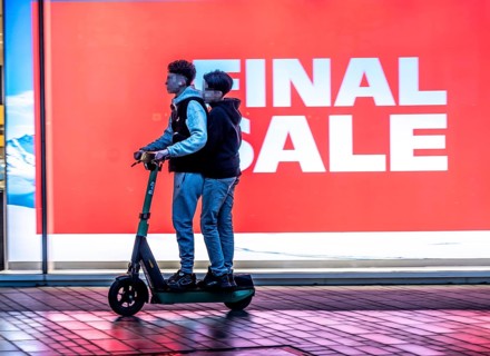 2 teenagers on an e-scooter, final sale, clothing department stores' on Schadowstraße, large poster
