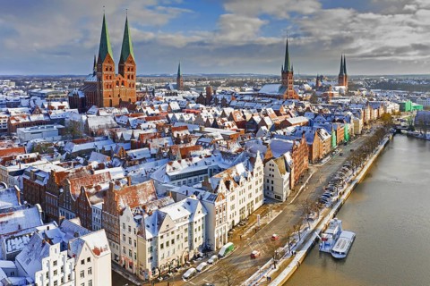 Aerial view over the river Trave and church towers in the old town of the Hanseatic City of Lübeck