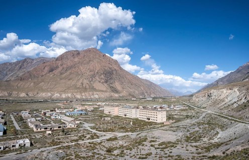 Abandoned ruined buildings in a mountain landscape, ghost town, Engilchek, Tian Shan, Kyrgyzstan,