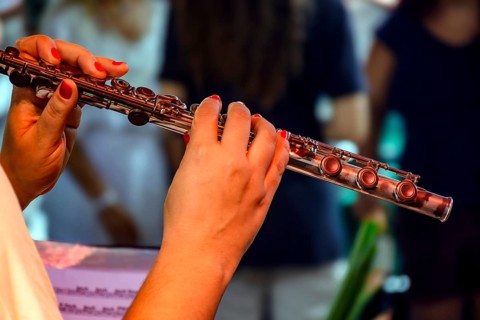 Woman's hands playing transverse flute during musical performance Belo Horizonte, Minas Gerais,