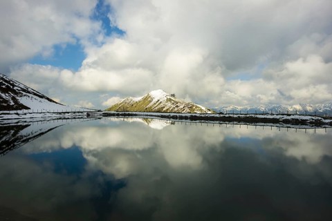 Riezler Alpsee, an artificial lake, snow pond, feeds the snow cannons that completely cover the