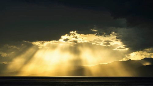 Sun rays in the clouds over Sicily, Tyrrhenian Sea, Italy, Europe