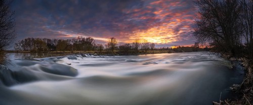 Long exposure of a waterfall at sunset, winter, panorama, river, Leine, Neustadt am Rübenberge,