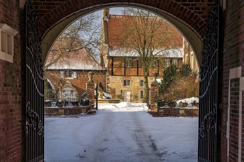 Portal to the moated castle Haus Borg in winter, Drensteinfurt, Münsterland, North