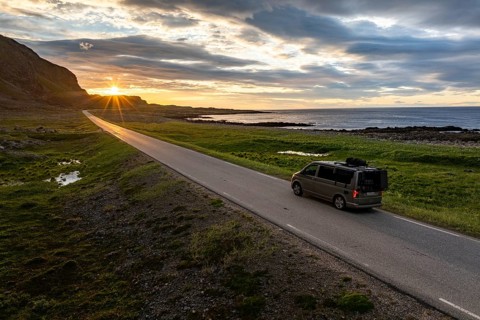 Camper van travelling along the road to Berlevåg, VW California, Barents Sea, Varanger, Finnmark,