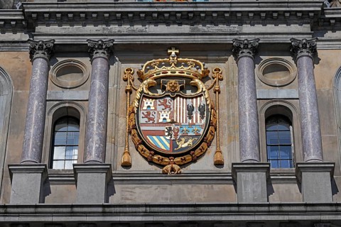 Historic City Hall Stadhuis on the Grote Markt, detailed view of the coat of arms of King Philip II