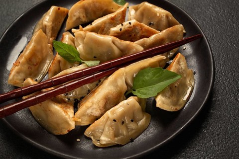 Japanese fried dumplings, gyoza, sesame seeds, top view, no people