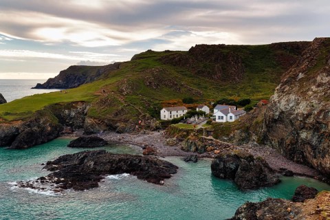 Restaurant, café in a former fisherman's hut in a remote bay, rocky coast at Kynance Cove, evening