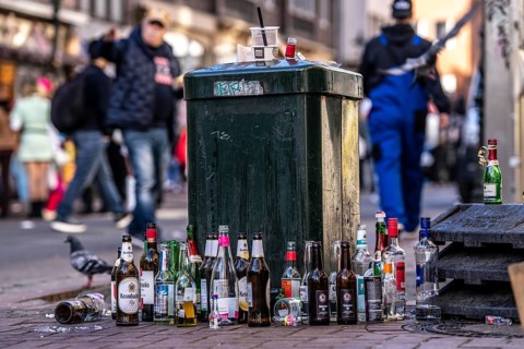 Rose Monday carnival parade in Düsseldorf, old town, empty bottles, various alcoholic beverages, at