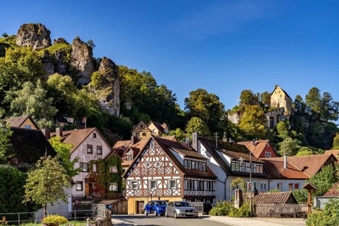 Half-timbered houses and the castle in Pottenstein in Franconian Switzerland, Bavaria, Germany,