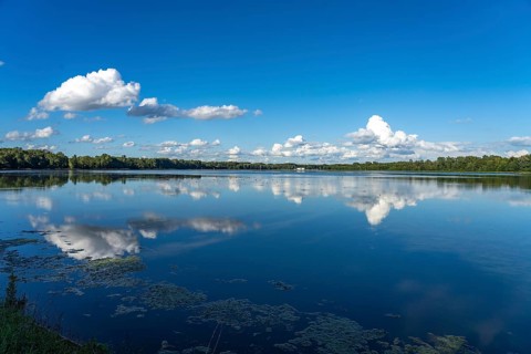 Clouds reflected in the Danube reservoir Faimingen, Lauingen Donau, Bavaria, Germany, Europe