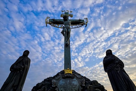 Crucifix and stone statues, Charles Bridge, Prague, Czech Republic, Europe