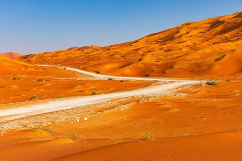 Wide road leads through the Rub al Khali desert, Dhofar province, Arabian Peninsula, Sultanate of