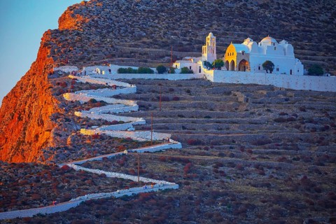View of Panagia Kimissis church built on a cliff above the sea, Chora, Folegandros Island, Cyclades