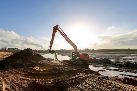 Dinslaken, North Rhine-Westphalia, Germany, Excavator in the construction site of the new Emscher
