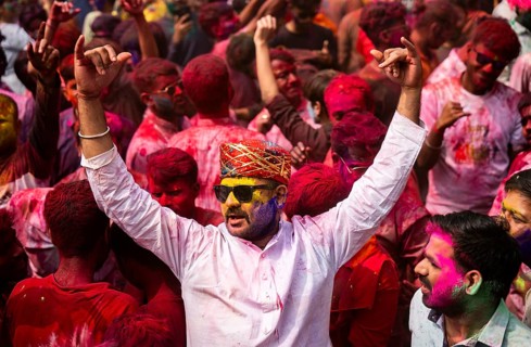 Revellers smear with Gulal or coloured powder and dance to play Holi, the Hindu spring festival of