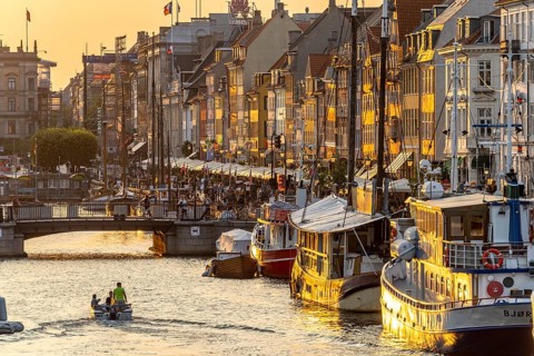 Colourful houses, restaurants and historic ships on the Nyhavn canal and harbour, Copenhagen,