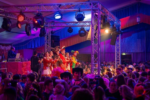 Festive atmosphere at a carnival party with a crowd in front of the stage, Fasching, Schlagerkuchen