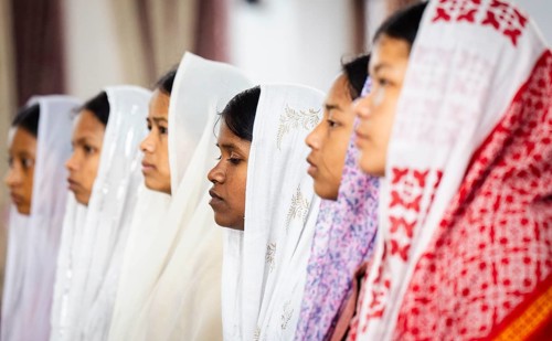 Devotees pray in church during a Christmas day sermon on December 25, 2024 in Guwahati, India.