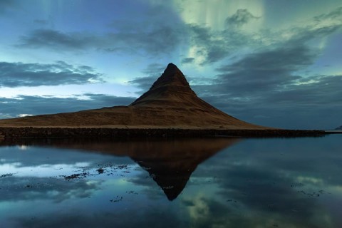 Northern Lights over Kirkjufell mountain, reflection in the sea, Grundarfjörður, Snæfellsnes