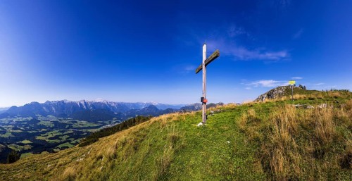 Summit cross on the Einberg with a view of the Lammertal and Tennengebirge mountains, Osterhorn